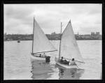 Two sailboats in a harbor, ca. 1935