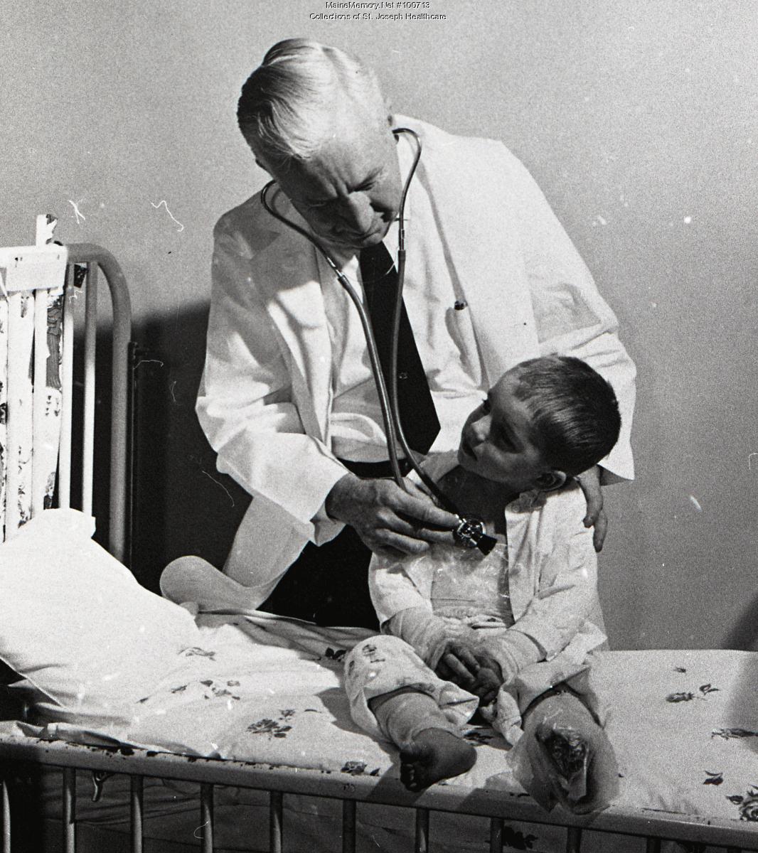 doctor-examining-child-patient-at-st-joseph-hospital-bangor-ca-1960